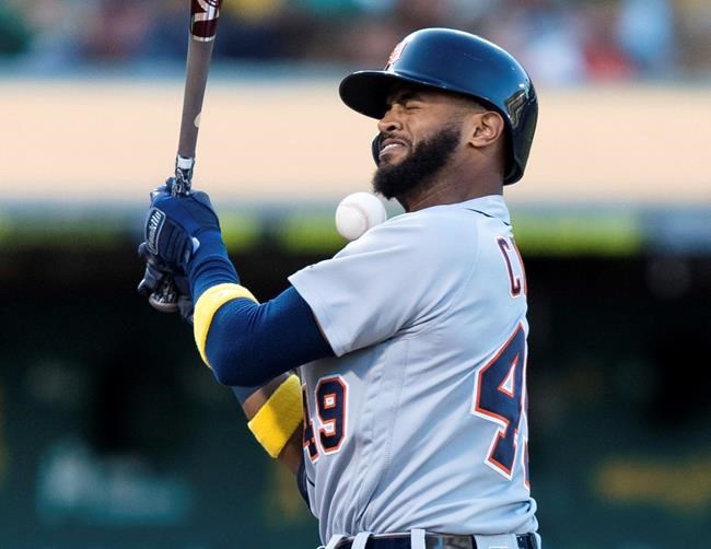 Detroit Tigers' Willi Castro is hit by a pitch from Oakland Athletics starter Chris Bassitt during the second inning of a baseball game Saturday, Sept. 7, 2019 in Oakland, Calif. (AP Photo/John Hefti)