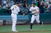 Oakland Athletics' Beau Taylor, right, is congratulated by third base coach Matt Williams after hitting a solo home run against the Baltimore Orioles during the third inning of a baseball game in Oakland, Calif., Tuesday, June 18, 2019. (AP Photo/Jeff Chiu)