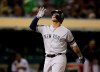 New York Yankees' Gleyber Torres celebrates after hitting a home run off Oakland Athletics' Tanner Roark during the seventh inning of a baseball game Thursday, Aug. 22, 2019, in Oakland, Calif. (AP Photo/Ben Margot)