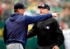 Seattle Mariners manager Scott Servais, left, argues with crew chief Mike Everitt after being ejected in the seventh inning of a baseball game against the Oakland Athletics Sunday, May 26, 2019, in Oakland, Calif. (AP Photo/Ben Margot)
