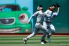 Seattle Mariners' J.P. Crawford, left, and Mac Williamson chase a fly ball hit by Oakland Athletics' Khris Davis in the sixth inning of a baseball game Sunday, June 16, 2019, in Oakland, Calif. Crawford made the catch. (AP Photo/Ben Margot)