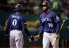 Seattle Mariners' Domingo Santana, right, is congratulated by Mallex Smith (0) after scoring against the Oakland Athletics during the seventh inning of a baseball game Friday, May 24, 2019, in Oakland, Calif. (AP Photo/Ben Margot)