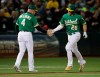 Oakland Athletics' Matt Chapman, right, celebrates with third base coach Matt Williams (4) after hitting a two-run home run off Seattle Mariners' Marco Gonzales during the fifth inning of a baseball game Tuesday, July 16, 2019, in Oakland, Calif. (AP Photo/Ben Margot)