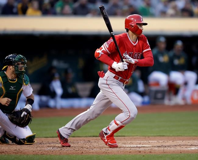 Los Angeles Angels' Shohei Ohtani singles off Oakland Athletics' Frankie Montas in the second inning of a baseball game, Tuesday, May 28, 2019, in Oakland, Calif. (AP Photo/Ben Margot)