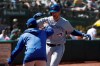 Toronto Blue Jays' Justin Smoak, right, is congratulated by a teammate after hitting a two-run home run against the Oakland Athletics during the seventh inning of a baseball game in Oakland, Calif., Sunday, April 21, 2019. (AP Photo/Jeff Chiu)