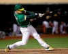 Oakland Athletics' Matt Chapman swings for a game-winning solo home run against the Cleveland Indians during the 12th inning of a baseball game Friday, May 10, 2019, in Oakland, Calif. (AP Photo/Ben Margot)