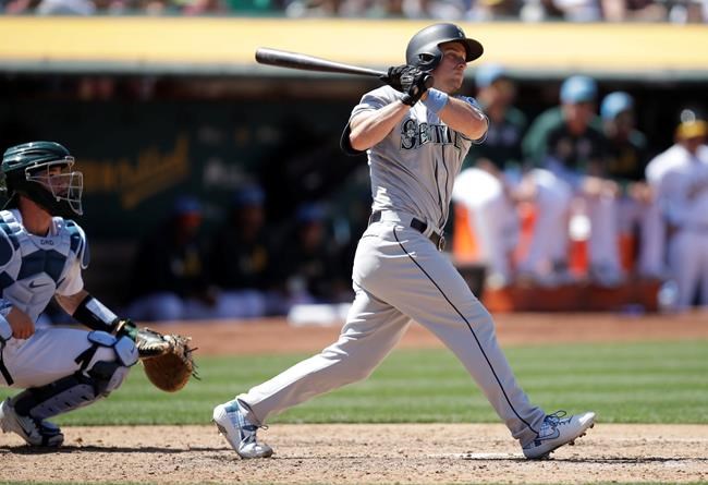 Seattle Mariners' Kyle Seager watches his two-run double hit off Oakland Athletics' Lou Trivino in the eighth inning of a baseball game Sunday, June 16, 2019, in Oakland, Calif. (AP Photo/Ben Margot)