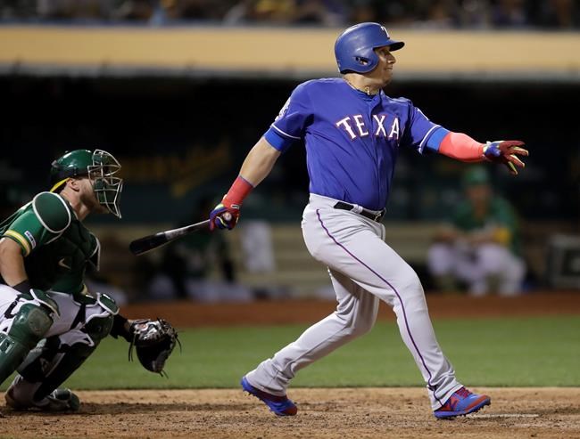 Texas Rangers' Asdrubal Cabrera swings for an RBI single against the Oakland Athletics in the sixth inning of a baseball game Friday, July 26, 2019, in Oakland, Calif. (AP Photo/Ben Margot)