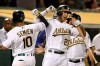 Oakland Athletics' Marcus Semien (10) celebrates with Matt Olson, right, after hitting a home run against the Texas Rangers during the fifth inning of a baseball game Saturday, Sept. 21, 2019, in Oakland, Calif. (AP Photo/Ben Margot)