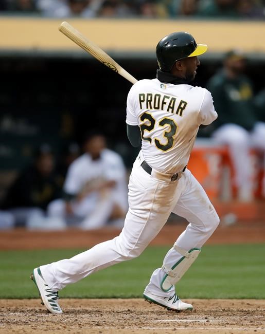 Oakland Athletics' Jurickson Profar swings for a two-run single off Seattle Mariners' Wade LeBlanc in the fourth inning of a baseball game Saturday, June 15, 2019, in Oakland, Calif. (AP Photo/Ben Margot)