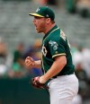 Oakland Athletics' Liam Hendriks celebrates as the final out is made against the Milwaukee Brewers in a baseball game Thursday, Aug. 1, 2019, in Oakland, Calif. (AP Photo/Ben Margot)