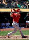 Los Angeles Angels' Jared Walsh follows through on an RBI single against the Oakland Athletics during the ninth inning of a baseball game in Oakland, Calif., Wednesday, May 29, 2019. (AP Photo/Jeff Chiu)