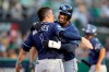 Tampa Bay Rays' Yandy Diaz, right, is congratulated by Willy Adames after hitting a solo home run against the Oakland Athletics during the third inning of an American League wild-card baseball game in Oakland, Calif., Wednesday, Oct. 2, 2019. (AP Photo/Ben Margot)