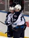 Alan Diaz / The Associated Press
Winnipeg Jets' Kyle Wellwood (13) is congratulated by teammate Bryan Little (18) after Wellwood scored against the Florida Panthers in the first period of an NHL hockey game, Monday in Sunrise, Fla.
