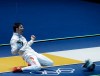 China's Man Zhong reacts after defeating South Korea's Junghwan Kim during the men's individual sabre round of 32 fencing at the 2012 Summer Olympics, Sunday, July 29, 2012, in London. (AP Photo/Andrew Medichini)
