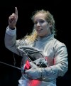 The United States' Mariel Zagunis asks for a ruling in her match against Japan's Seira Nakayama in the women's individual sabre fencing competition at the 2012 Summer Olympics, Wednesday, Aug. 1, 2012, in London.(AP Photo/Dmitry Lovetsky)