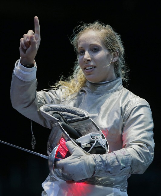 The United States' Mariel Zagunis asks for a ruling in her match against Japan's Seira Nakayama in the women's individual sabre fencing competition at the 2012 Summer Olympics, Wednesday, Aug. 1, 2012, in London.(AP Photo/Dmitry Lovetsky)