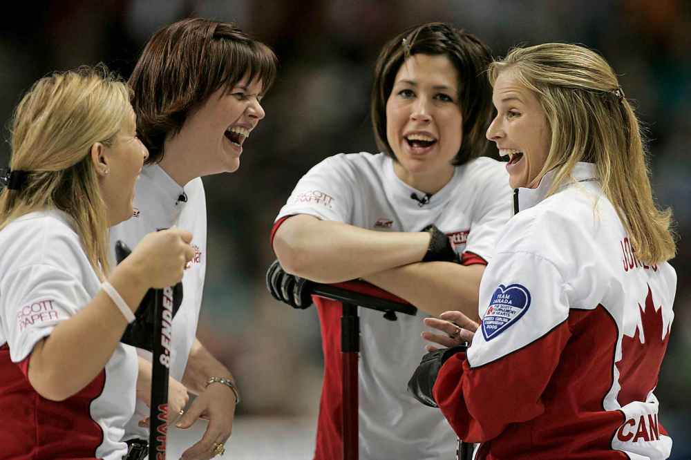 (CP PHOTO/Adrian Wyld)
Cathy Overton-Clapham (left), Georgina Wheatcroft, Jill Officer and skip Jennifer Jones (right) share a laugh during the Canadian womens curling championships in 2006.