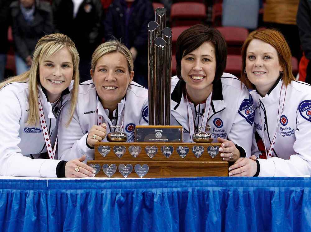 THE CANADIAN PRESS/Nathan Denette
Team Canada skip Jennifer Jones, left, third Cathy Overton-Clapham, second left, second Jill Officer, second right, and lead Dawn Askin, right, pose with the trophy after defeating Team Prince Edward Island 8-7 during final game action at the 2010 Scotties Tournament of Hearts in Sault Ste. Marie, Ont., 2010.
