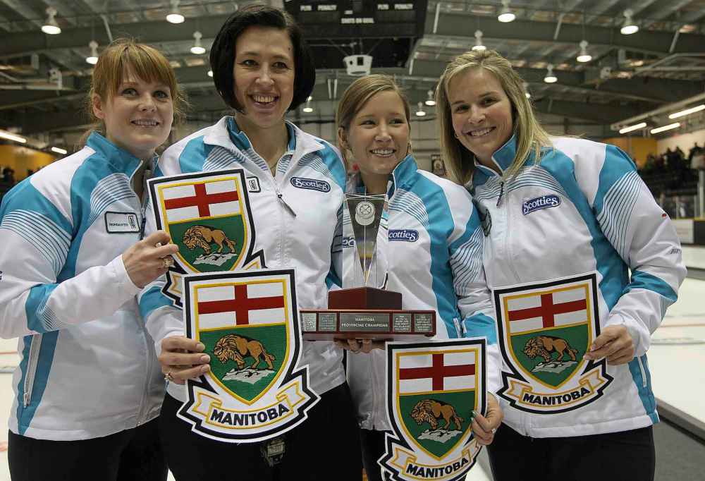 JOE BRYKSA / WINNIPEG FREE PRESS
Dawn Askin, Jill Officer, Kaitlyn Lawes, and Jennifer Jones celebrate their win of the 2012 Manitoba Scotties Tournament of Hearts in Portage La Prairie Manitoba, 2012