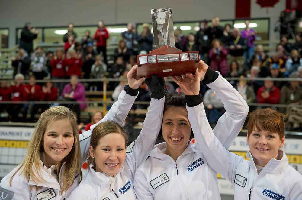 DAVID LIPNOWSKI / WINNIPEG FREE PRESS
Skip Jennifer Jones, Third Kaitlyn Lawes, Second Jill Officer, and Lead Dawn Askin of Team Jones celebrate winning the Scotties Tournament of Hearts in Stonewall, Manitoba in 2013.