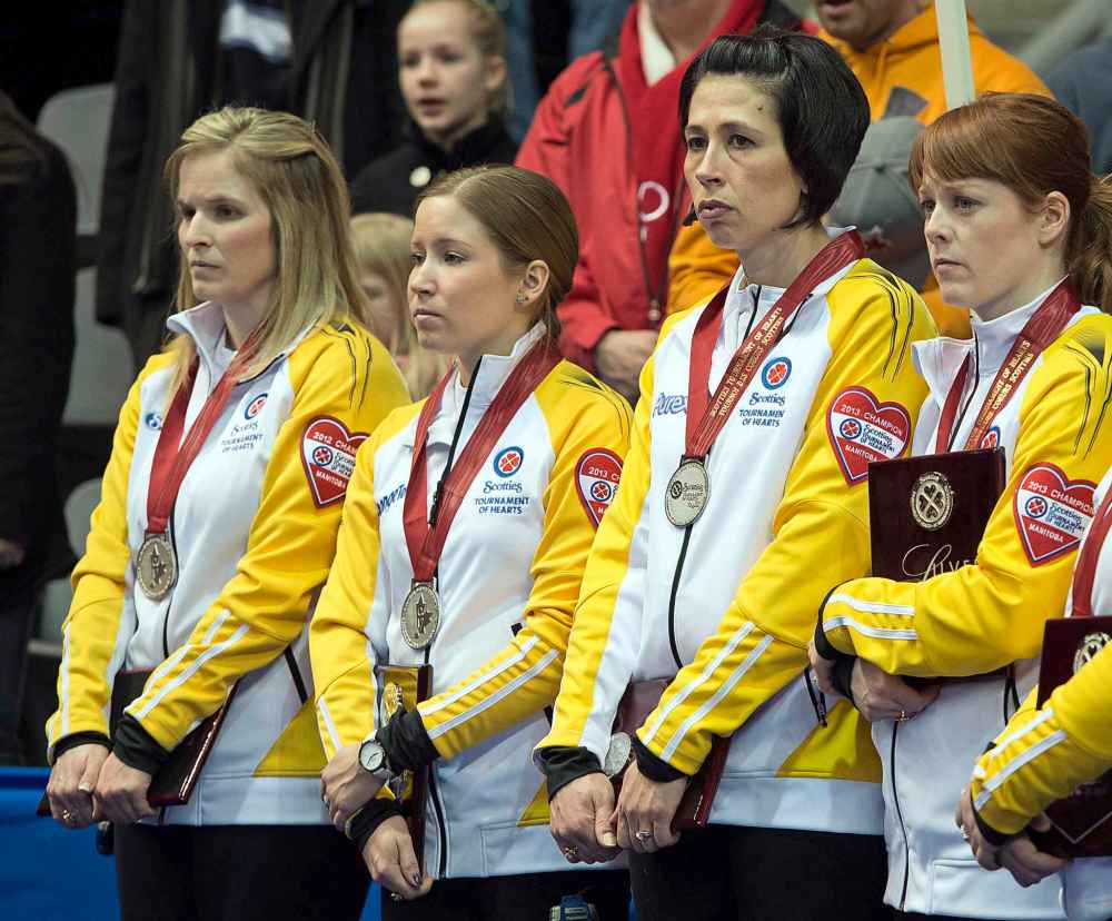 THE CANADIAN PRESS/Ryan Remiorz
Manitoba's skip Jennifer Jones, left, third Kaitlyn Lawes, second Jill Officer and lead Dawn Askin pose with their silver medals after losing 9-6 to Ontario the Scotties Tournament of Hearts in Kingston, Ont. in 2013