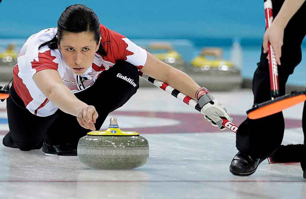 (AP Photo/Wong Maye-E)
Canada's Jill Officer releases the rock during the women's curling semifinal game against Britain at the 2014 Winter Olympics, in Sochi, Russia.