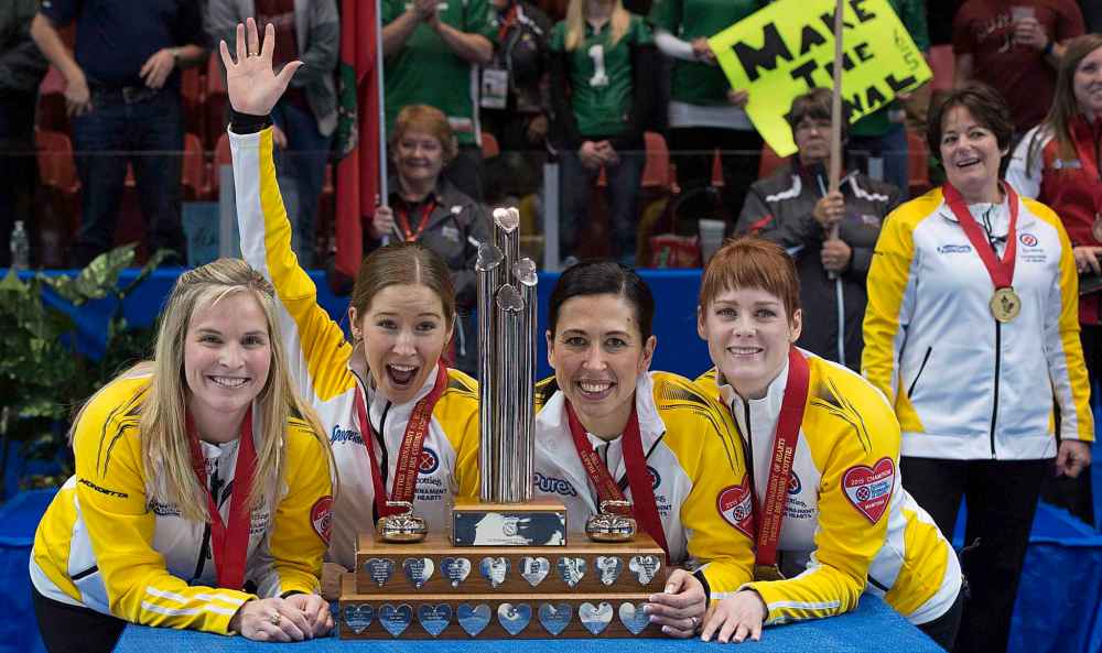 THE CANADIAN PRESS/Jonathan Hayward
Manitoba skip Jennifer Jones, left to right, third Kaitlyn Lawes, second Jill Officer and lead Dawn McEwen celebrate their win in the gold medal game against Alberta at the Scotties Tournament of Hearts in Moose Jaw, Sask. Sunday, Feb. 22, 2015.