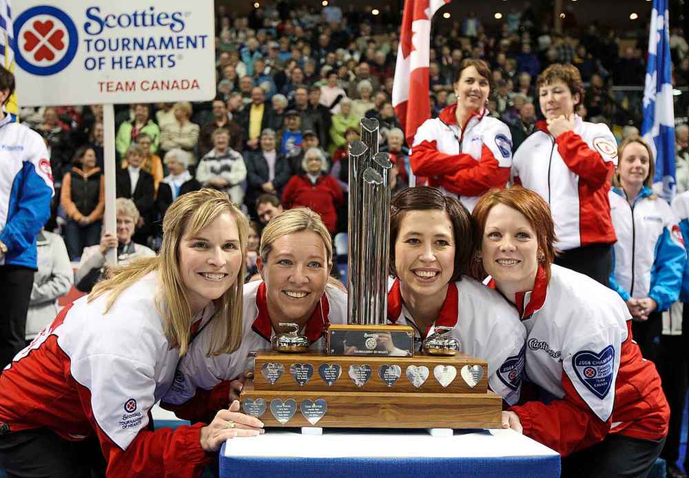 THE CANADIAN PRESS/Jonathan Hayward
Team Canada skip Jennifer Jones, left to right, Cathy Overton-Clapham, Jill Officer and Dawn Askin celebrate their teams 8-5 win over team British Columbia during the final at the Scotties Tournament of Hearts in Victoria, B.C., 2009.