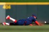 Cincinnati Reds' Eugenio Suarez dives but is unable to field a ball hit for a single by San Francisco Giants' Steven Duggar in the sixth inning of a baseball game, Sunday, May 5, 2019, in Cincinnati. (AP Photo/Aaron Doster)