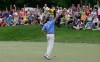 Matt Kuchar reacts after sinking a birdie putt on the 18th green during the final round of Memorial golf tournament on Sunday, June 2, 2013, in Dublin, Ohio. Kucher won the tournament. (AP Photo/Jay LaPrete)