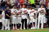 Cleveland Indians pitcher Carlos Carrasco, stands with Indians teammates during the fifth inning of the MLB baseball All-Star Game, Tuesday, July 9, 2019, in Cleveland. Carrasco, the Indians' right-hander, who was recently diagnosed with a form of leukemia, was saluted in the fifth inning of the game as part of Major League Baseball's 