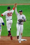 American League's Gleyber Torres, of the New York Yankees, and Mookie Betts (50), of the Boston Red Sox, celebrate the American League's 4-3 victory over the National League in the MLB baseball All-Star Game, Tuesday, July 9, 2019, in Cleveland. (AP Photo/Ron Schwane)