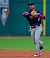 Minnesota Twins' Jorge Polanco throws to first base in the fourth inning of a baseball game against the Cleveland Indians, Saturday, July 13, 2019, in Cleveland. Indians' Oscar Mercado was out at first. (AP Photo/David Dermer)