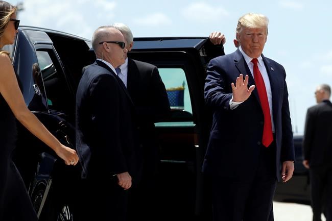 President Donald Trump and first lady Melania Trump, left, arrive to board Air Force One at Wright-Patterson Air Force Base after meeting with people affected by the mass shooting in Dayton, Ohio, Wednesday, Aug. 7, 2019, at Wright-Patterson Air Force Base, Ohio. (AP Photo/Evan Vucci)