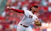 Cincinnati Reds starting pitcher Luis Castillo throws against the St. Louis Cardinals during the first inning of a baseball game, Saturday, July 20, 2019, in Cincinnati. (AP Photo/Gary Landers)