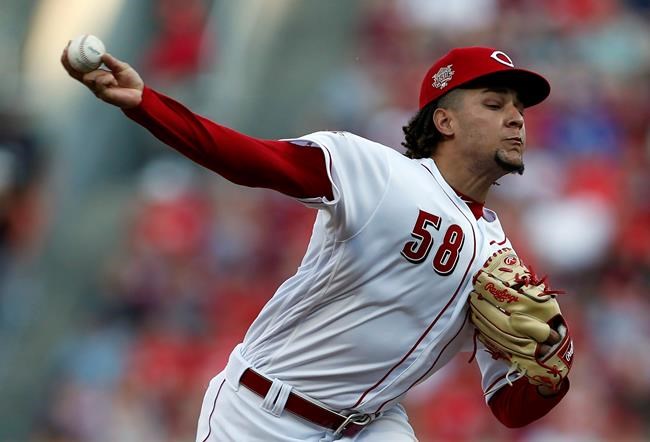 Cincinnati Reds starting pitcher Luis Castillo throws against the Los Angeles Angels during the first inning of a baseball game, Monday, Aug. 5, 2019, in Cincinnati. (AP Photo/Gary Landers)