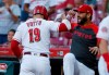 Cincinnati Reds' Joey Votto (19) is congratulated for his solo home run off Philadelphia Phillies starting pitcher Aaron Nola by Eugenio Suarez during the first inning of a baseball game Wednesday, Sept. 4, 2019, in Cincinnati. (AP Photo/Gary Landers)