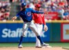 Chicago Cubs right fielder Jason Heyward, left, reaches second on an infield single by Addison Russell as Cincinnati Reds second baseman Scooter Gennett (3) defends during the fifth inning of a baseball game, Saturday, June 29, 2019, in Cincinnati. (AP Photo/Gary Landers)