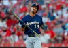 Milwaukee Brewers' Tyler Saladino (13) reacts to striking out against Cincinnati Reds starting pitcher Tyler Mahle during the third inning of a baseball game, Monday, July 1, 2019, in Cincinnati. (AP Photo/Gary Landers)