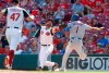 New York Mets' Amed Rosario (1) touches first base as Cincinnati Reds first baseman Joey Votto (19) takes the throw during the ninth inning of a baseball game, Sunday, Sept. 22, 2019, in Cincinnati. At left is Reds relief pitcher Sal Romano (47). Rosario was ruled out on the play after a review by umpires. (AP Photo/Gary Landers)