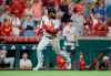 St. Louis Cardinals' Dexter Fowler rounds third base to score on a single by Kolten Wong off Cincinnati Reds relief pitcher Raisel Iglesias during the ninth inning of a baseball game Thursday, Aug. 15, 2019, in Cincinnati. (AP Photo/Gary Landers)