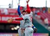 Philadelphia Phillies' Bryce Harper, left, and Rhys Hoskins (17) celebrate a win over the Cincinnati Reds in a baseball game Monday, Sept. 2, 2019, in Cincinnati. (AP Photo/Gary Landers)