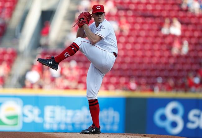 Cincinnati Reds starting pitcher Lucas Sims throws against the Pittsburgh Pirates during the first inning of a baseball game, Tuesday, May 28, 2019, in Cincinnati. (AP Photo/Gary Landers)