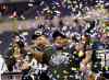 AJ Mast / Associated Press files
Michigan State's Denicos Allen holds up the trophy following the 2013 Big Ten Conference championship NCAA college football game against Ohio State in Indianapolis.