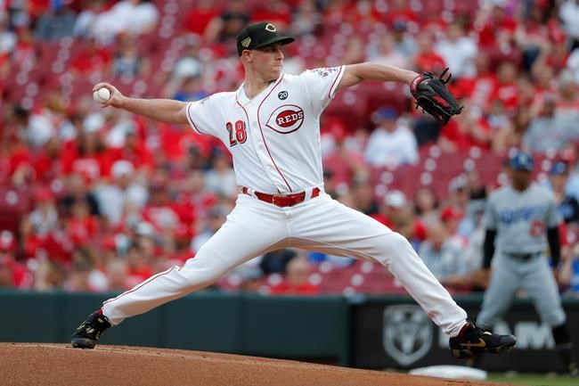Cincinnati Reds starting pitcher Anthony DeSclafani throws in the first inning of a baseball game against the Los Angeles Dodgers, Friday, May 17, 2019, in Cincinnati. (AP Photo/John Minchillo)