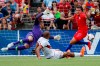 Venezuela forward Jose Salomon Rondon, center, scores against United States goalkeeper Zack Steffen (1) and defender Aaron Long (23) during the first half of an international friendly soccer match, Sunday, June 9, 2019, in Cincinnati. (AP Photo/John Minchillo)