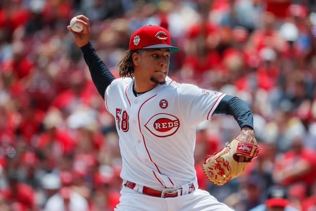 Cincinnati Reds starting pitcher Luis Castillo throws in the first inning of a baseball game against the Milwaukee Brewers, Thursday, July 4, 2019, in Cincinnati. (AP Photo/John Minchillo)