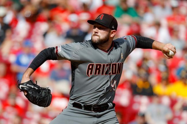 Arizona Diamondbacks starting pitcher Alex Young throws in the first inning of a baseball game against the Cincinnati Reds, Saturday, Sept. 7, 2019, in Cincinnati. (AP Photo/John Minchillo)