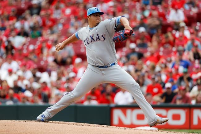 Texas Rangers relief pitcher Ariel Jurado throws in the first inning of a baseball game against the Cincinnati Reds, Sunday, June 16, 2019, in Cincinnati. (AP Photo/John Minchillo)